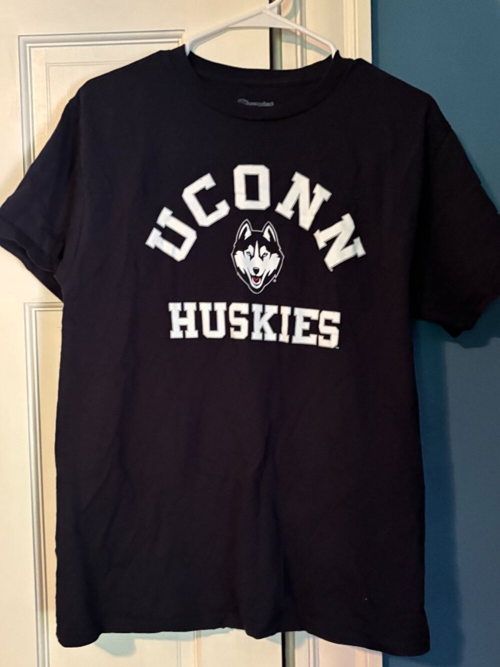 Medium dark navy blue UConn Huskies champion t-shirt.
